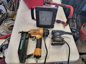 Red Work Light, Bostitch SB-1664FN Nailer and Ryobi Finishing Sander 