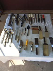 Group of Kitchen Utensils Including Ice Scoops, Whisks, Spatulas, Pizza Cutters and More