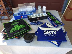 Assorted Bar Items Including Skyy Vodka Rubber Mats, Condiments Trays, Michelada Beer Hangers and More