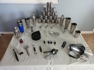 Large Group of Stainless Steel Items Including Ice Scoops, Moscow Mule Cups, Shot Glasses, Can Opener and More