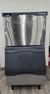 ICE MACHINE - SCOTTS MAN ICE MACHINE 400 LB PRODUCTION IN 24 HRS. BIN ALSO INCLUDED TO CATCH ICE. GREAT ADDITION TO ANY RESTAURANT OR BAR. RETAIL. $4500.00
