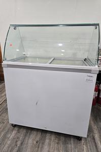 DIPPING CABINET - DIPPING CABINET 6 TUB TO SHOW WITH EXTRA STORAGE BELOW. SHOWCASE TO SELL ALL YOUR FAVORITE FLAVORS. NICE SLEEK CURVED GLASS DESIGN. CURVED GLASS SNEEZEGUARD. RETAIL $1200.00