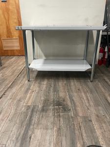STAINLESS TABLE  - *** BRAND NEW *** 4 FT HEAVY DUTY COMMERCIAL STAINLESS STEEL TABLE. UNDERSHLEF UNDERNEATH FOR STOARGE OF ALLK SORTS. GREAT SURFACE FOR FOOD PREP OR TO PUT APPLIANCES. GREAT FOR WORK OR HOME. RETAIL $250.00 