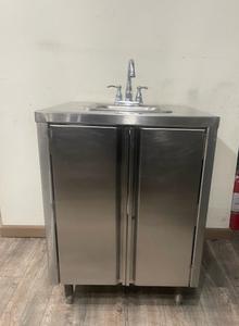 SINK CABINET - STAINLESS STEEL CABINET WITH INTEGRATED SINK SIDE SPLASHES TO PREVENT WATER SPLASHING. 2 DOORS UNDERNEATH THAT CAN USED FOR STORAGE. SMALL SLEEK DESIGN THAT COULD FIT JUST ABOUT ANYWHERE. 