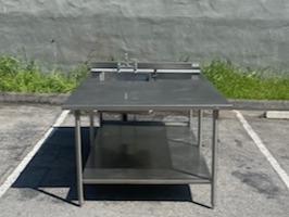TABLE SINK - STAINLESS STEEL TABLE WITH SINK. HEAVY DUTY. GREAT FOR WORK/ PREP STATION. PREP, CUT, AND WASH ALL ON ONE STATION.