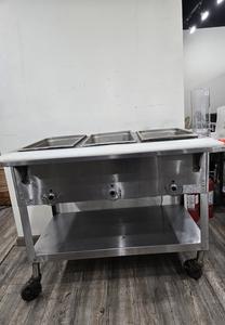 STEAM TABLE - DUKE 3 HOLE STEAM TABLE ON CASTERS. 3 COMPARTMENTS TO KEEP VARIOUS FOOD WARM. HOLE SIZE MADE FOR DIFFERNET SIZE PANS THAT CAN USED IN MULTIPLE CONFIGURATIONS. RETAIL $1300.00