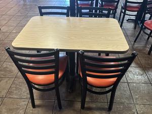 Commercial Dining Table and (4) Dining Chairs with Orange Upholstered Cushioned Seats