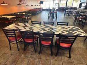 Long Commercial Dining Table with Chevron Pattern Top and (8) Dining Chairs with Red Upholstered Cushioned Seats