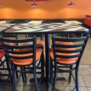 Commercial High Top Dining Table with Chevron Pattern Top and (4) Dining Bar Stools with Orange Upholstered Cushioned Seats