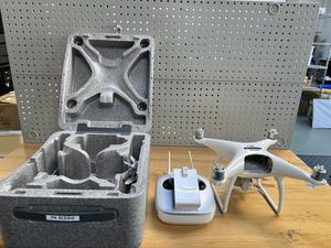 DJI Phantom-4 Drone with Remote Control, Charger and Case 