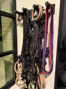 Group of Workout Bands and Gym Training Rings with Wall Mounts