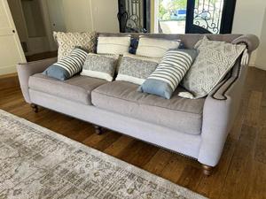Grey Fabric Upholstered Sofa on Wood Feet with Multiple Throw Pillows 
