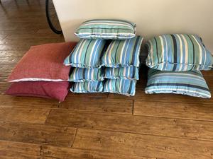 (9) Green Striped Throw Pillows and (2) Burgundy Throw Pillows 
