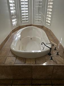 Oval Whirlpool Jetted Tub with Rubbed Nickel Faucet 