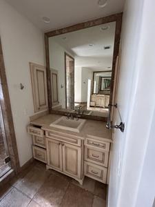 Cream Colored Vanity with Stone Countertop, Large Mirror, Sink, Brushed Nickel Faucet and (2) In-Set Medicine Cabinets