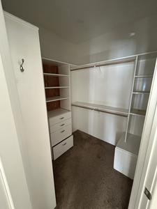 Complete Closet System with Shelves, Rods, Drawers and Raised Panel Door 