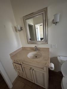 Cream Colored Vanity with Stone Countertop, In-Set Medicine Cabinet, (2) Light Fixtures, Sink and Brushed Nickel Faucet 